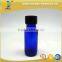 1/2 oz blue glass boston round bottle with black phenolic cap