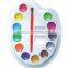 Watercolor paints set with plastic palette and a brush