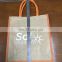 Large laminated jute tote bag with colored handle and bottom gusset