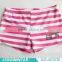 pink and white child swimwear