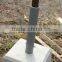 Cement block base stone for clothesline pole