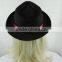 Black cowboy hat setting cap with red ribbon