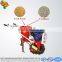 Hand walking tractor seeder with seeds of peanut planting machines