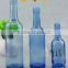 Factory direct sale light blue glass bottles beverage wine bottles fancy primary color bottles