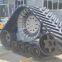 Replacing the tires of agricultural harvesters with triangular track assembly to prevent sinking and slipping