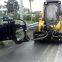 Port guardrail cleaning machine for skid steer loader