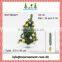 Set of silver hanging balls and small artificial christmas tree