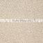Machine tufted loop pile wall to wall carpet