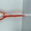 orange plastic shovel handle