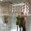 Artificial colourful cherry blossom garland for window display