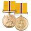 Round commemorative metal medal on Webbing