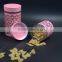 pink metal cover clear glass canister