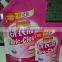 liquid detergent standing pouch with handle and spout