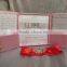 Hot sale luxurious pink silk hardcover wedding invitations with red ribbons&rhinestone brooches