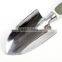 Green product hand holding plastic handle garden tool set