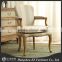 antique upholstered dining chair with armrest
