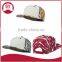 Short brim snapback hat with an adjustable plastic snapback strap closure