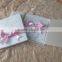 2016 hot sale customized romantic lace wedding invitation cards with bowknot made of pink ribbons and pearl decoration                        
                                                Quality Choice