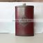 big stainless steel hip flask with leather covered