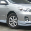 The Toyota Corolla car is surrounded by a 11-13 Carora front and rear spoiler skirt