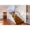 Wood step close riser metal railing curved staircases