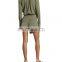 Partial front button placket, attached faux-wrap skirt detail with self-tie sash