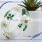 Pine needles inside transparent clear acrylic bangle stand