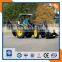 Farm tractor with front loader and backhoe loader