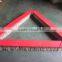 Triangular brush for artificial grass installation