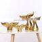 ceramic artwork of golden whale tail ornaments