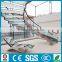 hotel lobby curved stainless steel glass staircase