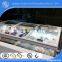 Bent small radius curved tempered laminated glass lids for island cabinet