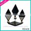 Diamond Shape Wall Mirror With Candle Holder Putting On The Desk