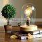 Decorative indoor cloche table light with Edison filament bulbs