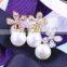 Women 's gold plated flower rhinestone pearl earrings