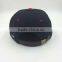 wholesale custom design your own logo 7 panel black snapback hat with woven label