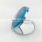 Small round metal pocket mirror