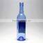 Blue clear glass wine bottle witn long neck beer bottle