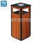 Wooden and steel outdoor trash can