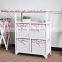 wooden folding ironing board in cabinet