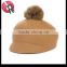 wool felt hat with fur ball on the top