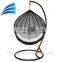 Egg shaped rattan outdoor patio swing chair with beige seat cushion