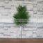 Plastic green cypress branch