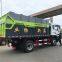 Hook arm garbage truck