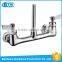 Modern kitchen design wall mounted spring loaded kitchen sink mixer tap brass faucet
