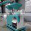 Automatic small scale corn grinder