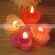 Hand made mouth blown heart shaped clear and red glass candle holder with different color candles