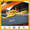 Rotating container lifting spreader