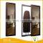 Space saving ironing board with sliding mirror door