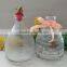 Hanging glass bee catcher with metal handle and wood cork stopper for home and garden use
